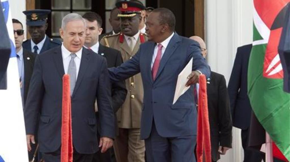 Israeli Prime Minister Benjamin Netanyahu, left, and Kenyan President Uhuru Kenyatta walk together to give a joint press conference at State House in Nairobi, Kenya, Tuesday, July 5, 2016. AP