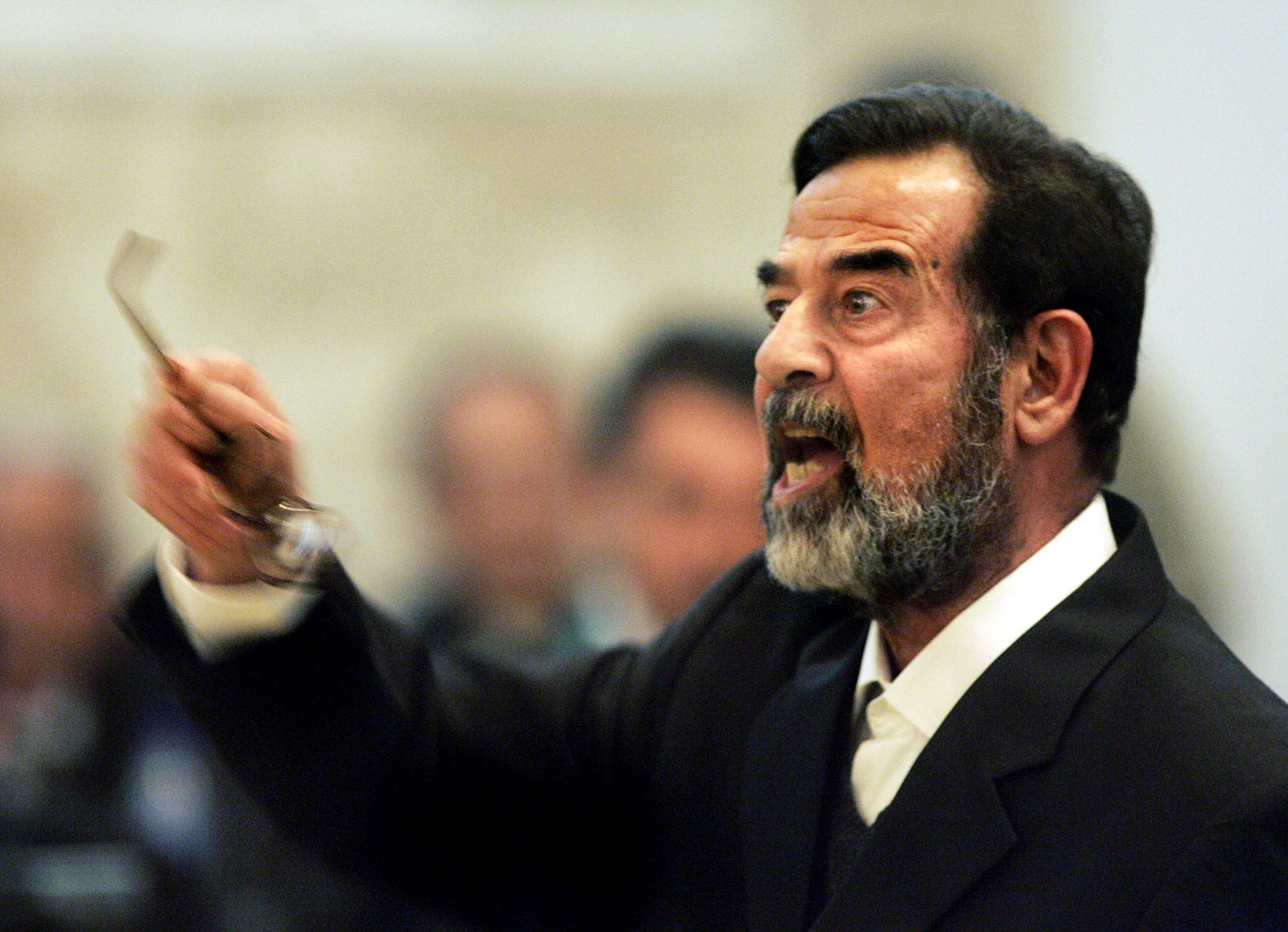 صدام حسين أثناء محاكمته - وكالات