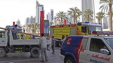 Rescue crews are seen outside the Dubai Mall in Dubai, United Arab Emirates, Thursday Feb. 25, 2010. A large section of the Middle East's biggest shopping mall has been closed as maintenance crews scramble to contain a leak at the massive, shark-filled aquarium there. An official at Dubai's civil defense department said "there has been a small break in the glass". (AP Photo/Farhad Berahman)