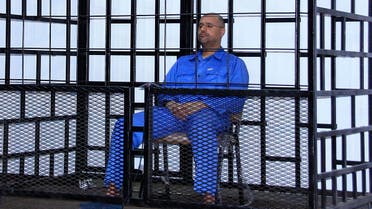 Saif al-Islam Qaddafi, son of late Libyan leader Muammar Gaddafi, attends a hearing behind bars in a courtroom in Zintan May 25, 2014. (Reuters)