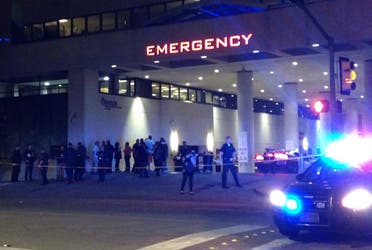 Police and others gather at the emergency entrance to Baylor Medical Center in Dallas, where several police officers were taken after shootings Thursday, July 7, 2016. (AP)