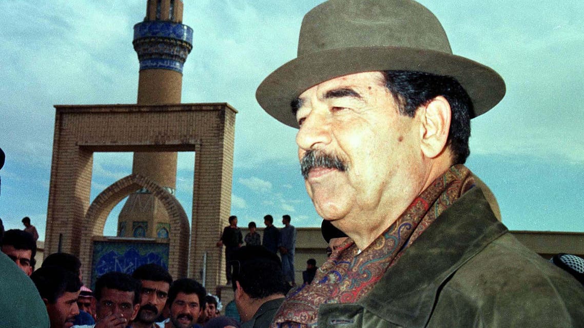 Iraqi President Saddam Hussein greets people of the village of al-Budoor, 180 km (110 miles) from Baghdad, March 29. Saddam regaled villagers with daring tales from his youth while U.N. weapons inspectors scoured his hometown palace. (Reuters)