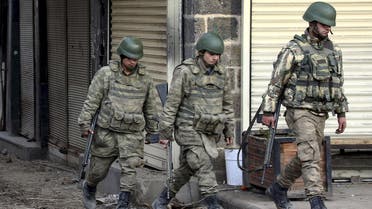 Turkish soldiers patrol in Sur district, which is partially under curfew, in the Kurdish-dominated southeastern city of Diyarbakir, Turkey February 26, 2016.(Reuters)