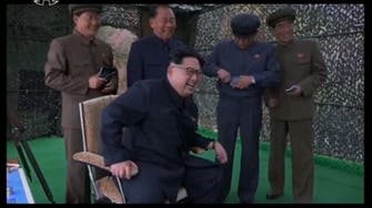 Kim Jong-un seen laughing at submarine missile launch