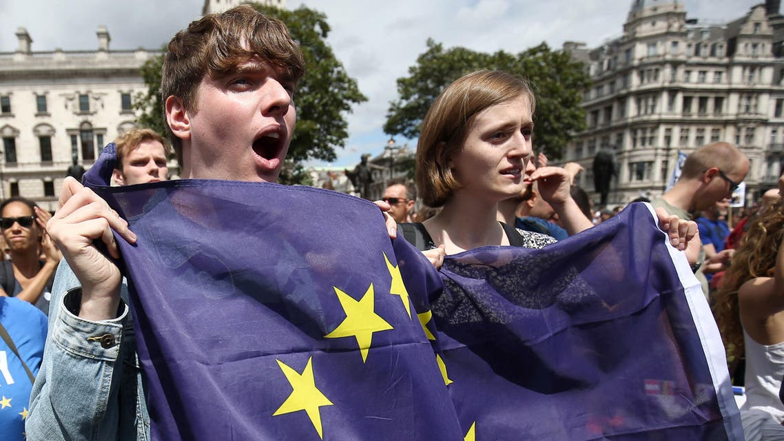 People hold flags during a 'March for Europe' demonstration against Britain's decision to leave the European Union, in central London, Britain July 2, 2016. (Reuters)