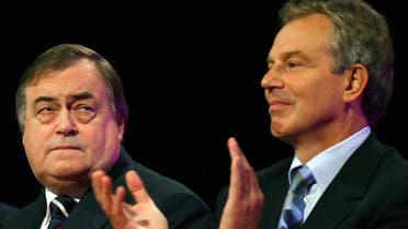 Britain's Deputy Prime Minister John Prescott (L) and Prime Minister Tony Blair react to speeches during the annual Labour Party conference in Manchester, northern England September 28, 2006. (Reuters)