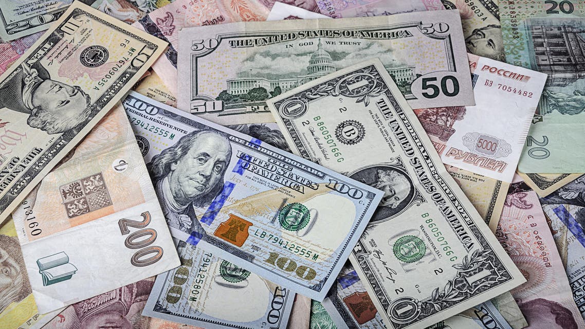 International currencies scrambled randomly ontop of each other. (Shutterstock)