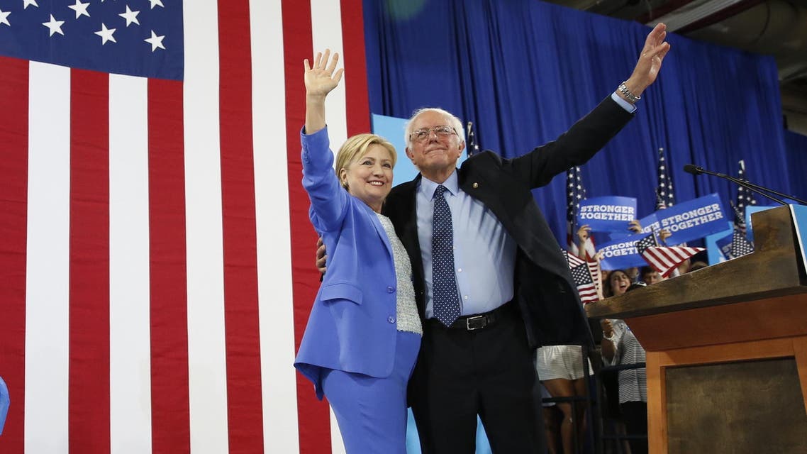 Democratic presidential candidate Hillary Clinton and Sen. Bernie Sanders, I-Vt. wave during a rally in Portsmouth, N.H., Tuesday, July 12, 2016. (AP)