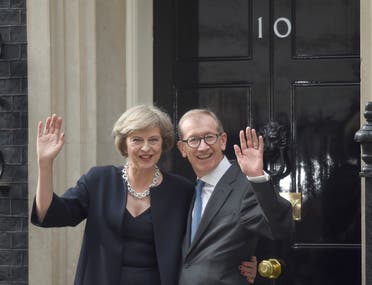 Britain's Prime Minister, Theresa May, and husband Philip pose for the media outside number 10 Downing Street, in central London, Britain July 13, 2016. (Reuters)