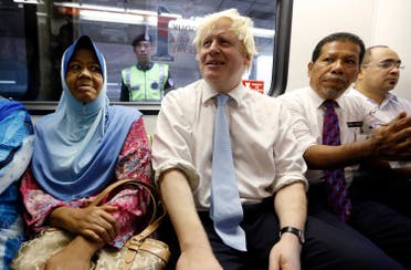 London's Mayor Boris Johnson rides on the monorail during an official visit to Kuala Lumpur. (File photo: Reuters)