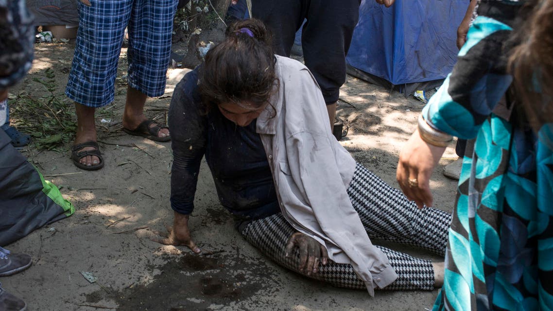 Migrants said they were brutally beaten and abused by officials as well as a local “civil militia” patrolling the border. (AP)