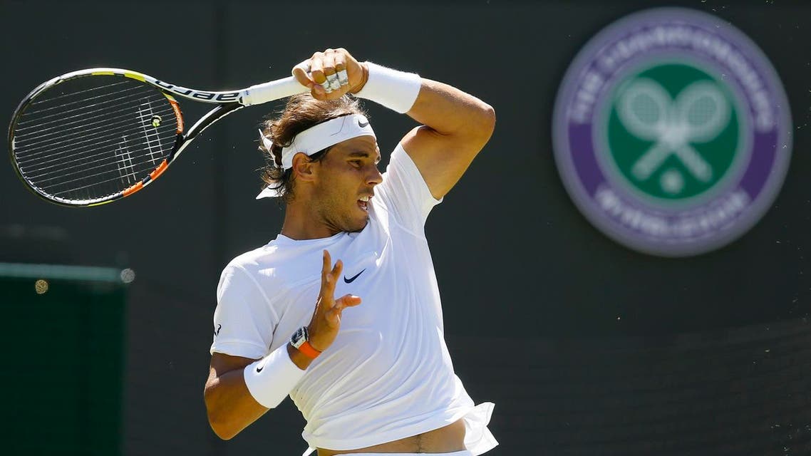 Rafael Nadal returns a ball to Thomaz Bellucci of Brazil during their singles first round match at the All England Lawn Tennis Championships in Wimbledon, London (File Photo: AP)