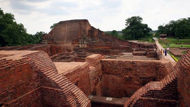 In this July 5, 2006 file photo, tourists walk at the ruins of the Nalanda University at Nalanda, India. AP