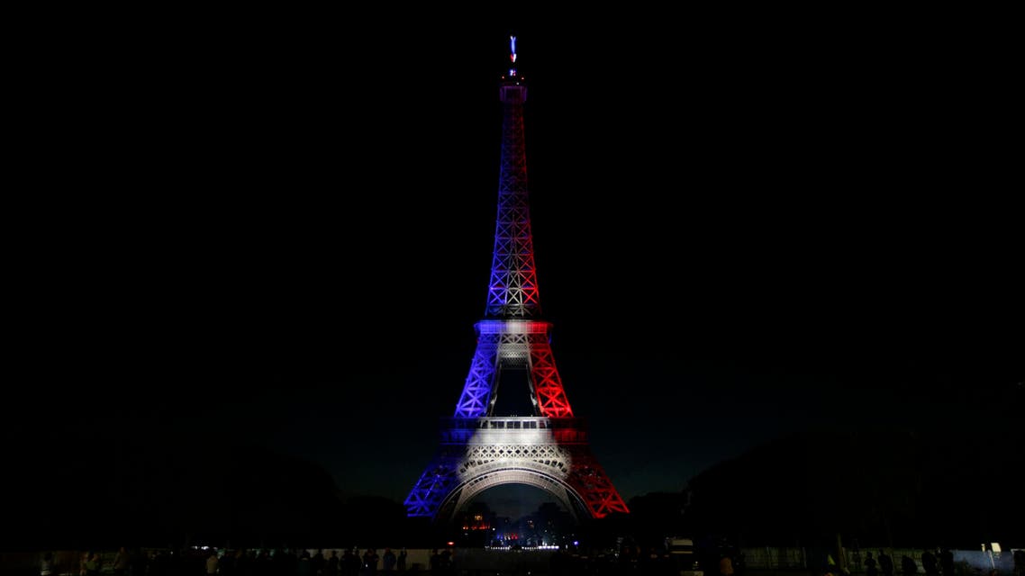A picture taken on July 14, 2016 shows the Eiffel Tower illuminated with the colours of the French flag in the French capital Paris, as part of France's annual Bastille Day celebrations. AFP
