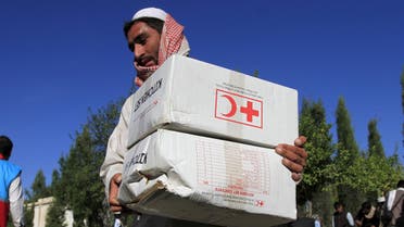 An Afghan man receives aid from the International Federation of the Red Cross and Red Crescent Societies after an earthquake, in Behsud district of Jalalabad province, Afghanistan October 28, 2015. (File Photo Reuters