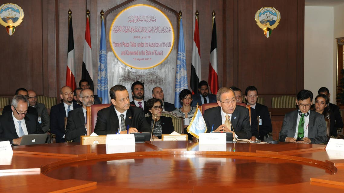 In this Sunday, June 26, 2016 photo released by the Kuwait Ministry of Information and made available Monday, June 27, U.N. Secretary General Ban Ki-moon, center right, talks with a member of the Yemeni delegation during the Yemeni Peace Talks in Kuwait. AP