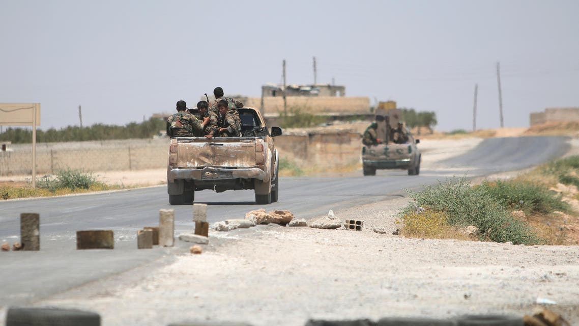 Syria Democratic Forces (SDF) ride vehicles along a road near Manbij, in Aleppo Governorate, Syria, June 25, 2016. reuters