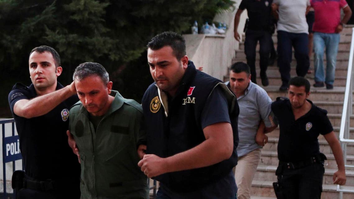 Members of Turkey armed forces are escorted by police for their suspected involvement in Friday's attempted coup at the court house in Mugla, a Mediterrenean city of Turkey, Sunday, July 17, 2016. Following a failed coup against Turkish President Recep Tayyip Erdogan, his government moved swiftly to shore up his power and remove those perceived as an enemy, saying it has detained 6,000 people. (Tolga Adanali/Depo Photos via AP)