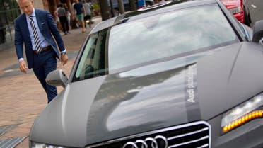 cott Keogh President of Audi of America, walks past an Audi self driving vehicle parked on Pennsylvania Ave., near the Capitol Building in Washington, Friday, July 15, 2016. (AP)