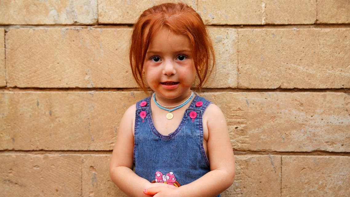 A displaced girl from the Yazidi minority, who fled violence from ISIS militants in the Iraqi town of Sinjar, poses for a portrait at the holy Lilash temple in northern Iraq September 20, 2014. (File photo: Reuters)