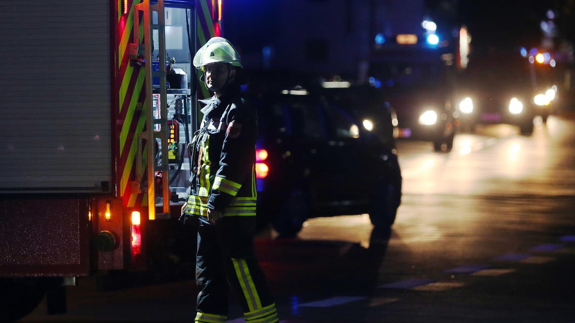 A firefighter stands at a road block in Wuerzburg, southern Germany, Monday evening July 18, 2016. A man attacked people in a train and injured more than a dozen. (AP)