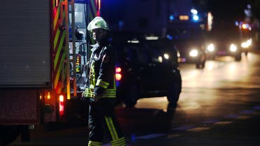 A firefighter stands at a road block in Wuerzburg, southern Germany, Monday evening July 18, 2016. A man attacked people in a train and injured more than a dozen. (AP)