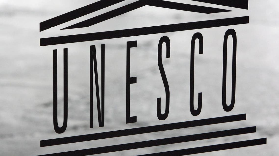 The United Nations Educational, Scientific and Cultural Organisation (UNESCO) logo is seen on a glass door at the UNESCO headquarters in Paris, Saturday Sept. 19, 2009. (AP)