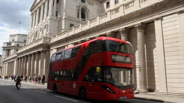 A bus carries passengers past the Bank of England in London on Thursday July 14, 2016. The Bank of England surprised financial markets by opting against cutting interest rates on Thursday, despite clear evidence of the initial economic damage caused by the country’s vote last month to leave the European Union. (AP Photo/Adela Suliman)