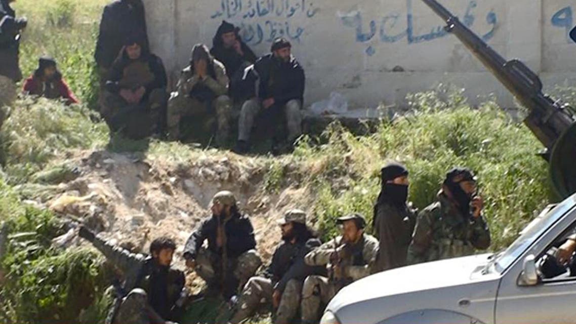 This file image posted on the Twitter page of Syria's al-Qaida-linked Nusra Front on Saturday, April 25, 2015, which is consistent with AP reporting, shows Nusra Front fighters in the town of Jisr al-Shughour, Idlib province, Syria. Al-Qaida’s branch in Syria has recruited hundreds of new fighters, including teenagers, and taken territory from government forces in a successful offensive in the north, illustrating how the cease-fire put in place by Russia and the United State to weaken the militants has in many ways backfired. (Al-Nusra Front Twitter page via AP, File)