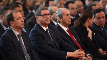 Tunisian Prime Minister Habib Essid (C-L) and Tunisian Assembly President Mohamed Ennaceur (C-R) attend a memorial ceremony at the Bardo museum in Tunis on March 18, 2016.