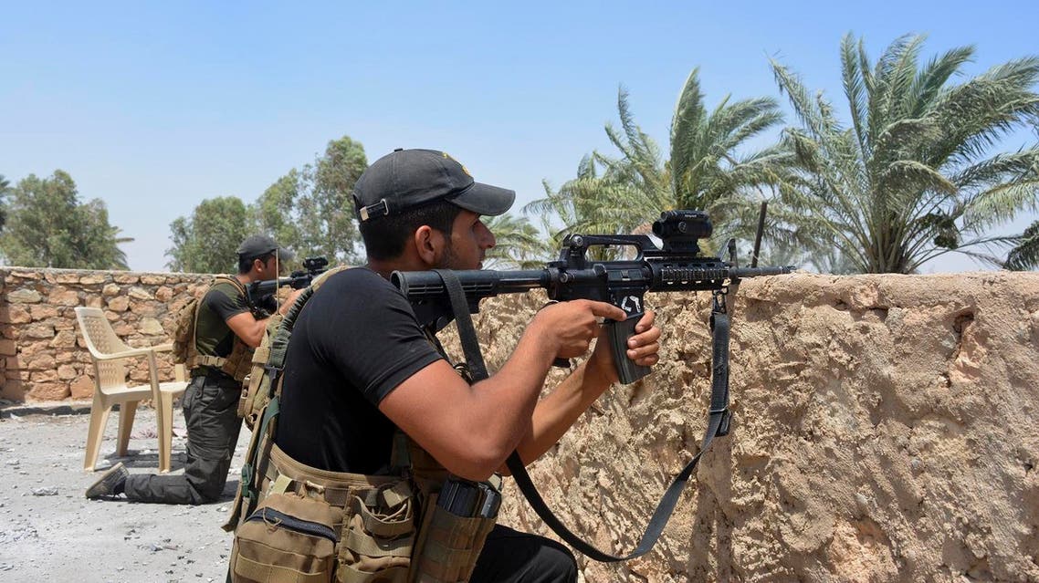 Iraqi soldiers scan the area during a military operation to regain control of villages north of Ramadi, 70 miles (115 kilometers) west of Baghdad, Iraq, Saturday, July 9, 2016. In the mostly Sunni province of Anbar, west of Baghdad, government troops on Saturday consolidated their grip on the provincial capital of Ramadi, retaken from the IS last year, when they captured two villages just north of the city. (AP)