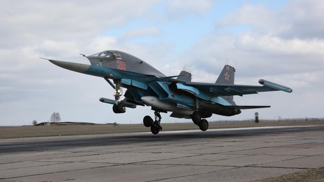 In this photo provided by the Russian Defense Ministry Press Service, Russian Su-34 bomber lands after returning from Syria at an airbase near the Russian city Voronezh, Tuesday, March 15, 2016.