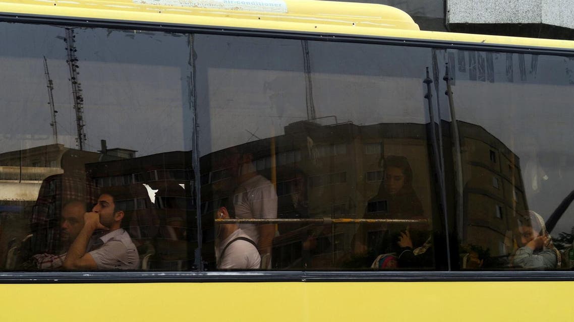 Commuters ride in a bus during evening rush hour in Tehran, Iran May 2, 2016. REUTERS/Marius Bosch