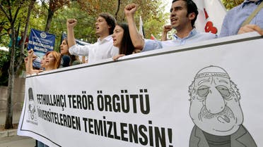 Pro-nationalist university students shout during a protest against U.S.-based cleric Fethullah Gulen and his followers during a demonstration in Ankara, on July 21, 2016.(AFP)