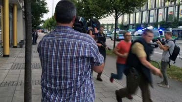Armed police move past onlooking media responding to a shooting at a shopping center in Munich, Germany, Friday July 22, 2016. Munich police confirm shots have been fired at Olympia Einkaufszentrum shopping center but say they don't have any details about casualties. Police are responding in large numbers. (AP)