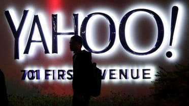 A person walks in front of a Yahoo sign at the company's headquarters in Sunnyvale, Calif. Verizon bought Yahoo in a sale announced Monday, July 25, 2016 (Photo: AP)