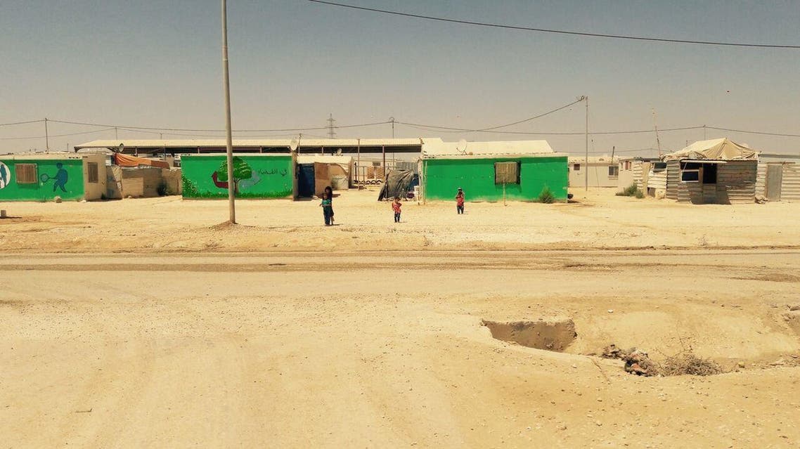 Children playing at Zaatari camp. Some of the camp inhabitants have painted their homes to add a little colour to the bleak surroundings. (UNICEF/MENA/Dakhlallah)