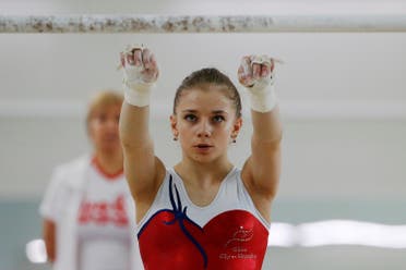 Member of the women's gymnastics Russian Olympic team Evgeniya Shelgunova attends a training session at the Ozero Krugloe (Round Lake) training centre outside Moscow, Russia, July 21, 2016. REUTERS