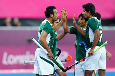 Pakistan's players celebrate their goal against Argentina during their men's Group A hockey match at the London 2012 Olympic Games at the Riverbank Arena on the Olympic Park August 1, 2012. REUTERS