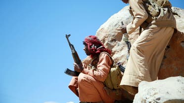 Yemeni tribesmen from the Popular Resistance Committees hold a position during ongoing fight against Houthis and their allies west of Marib city. (AFP)