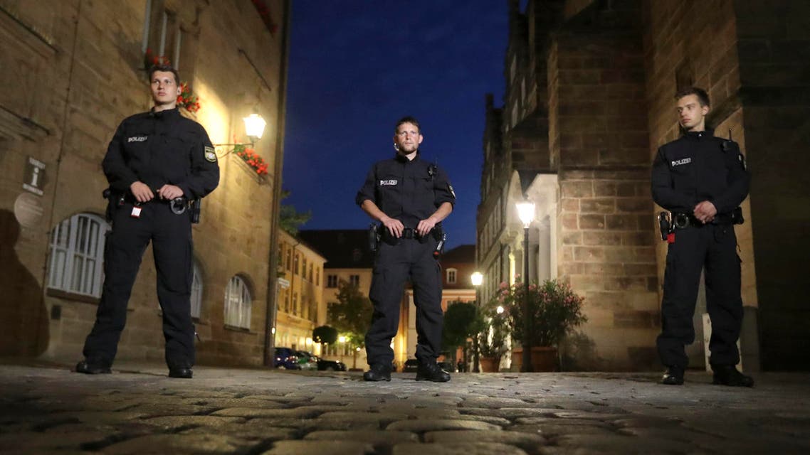Police officers secure the area after a bomb attack in Ansbach, Germany, Monday, July 25, 2016. (AP)