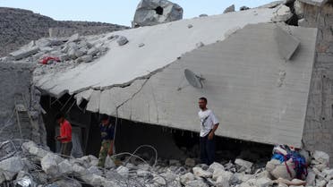 Syrians check a damaged house, reportedly hit by US-led coalition air strikes, in the village of Kfar Derian in the western Aleppo province on September 23, 2014. (AFP)