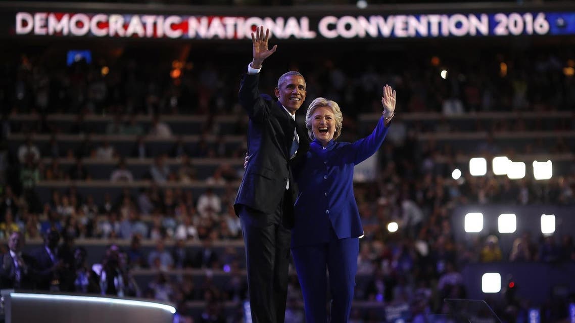 U.S. President Barack Obama and Democratic presidential nominee Hillary Clinton appear onstage together after his speech on the third night at the Democratic National Convention in Philadelphia, Pennsylvania, U.S. July 27, 2016. REUTERS/Carlos Barria