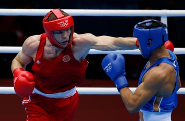 Russia's Egor Mekhontcev (L) fights Kazakhstan's Adilbek Niyazymbetov during their Men's Light Heavy (81kg) gold medal boxing match at the London Olympics August 12, 2012. (Reuters)