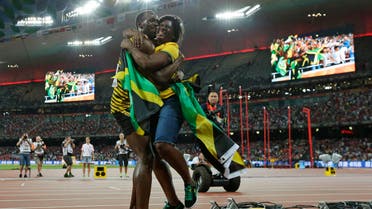 In this Aug. 23, 2015 file photo, Jamaica's Usain Bolt hugs his mom, Jennifer Bolt, after winning the men's 100m final at the World Athletics Championships at the Bird's Nest stadium in Beijing. AP