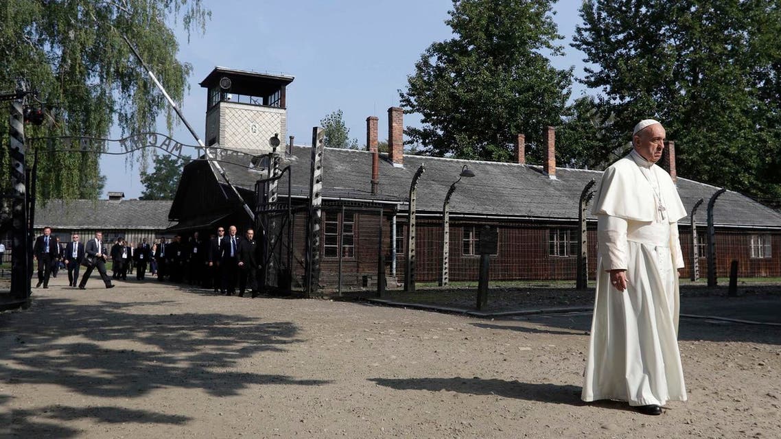 Pope Francis walks through the gate of the former Nazi German death camp of Auschwitz in Oswiecim, Poland, Friday, July 29, 2016 (Photo: AP)