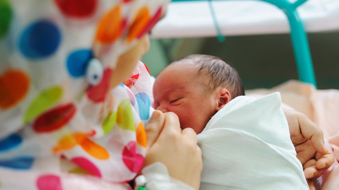 An Arab woman breastfeeds her baby (Shutterstock)