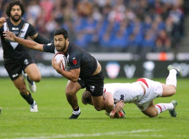 New Zealand's Pete Hiku is tackled by England's George Williams. (Reuters)