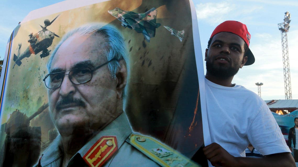 A man holds a picture of General Khalifa Haftar during a demonstration in support of the Libyan army under the leadership of General Khalifa in Benghazi, Libya November 6, 2015. (Reuters)
