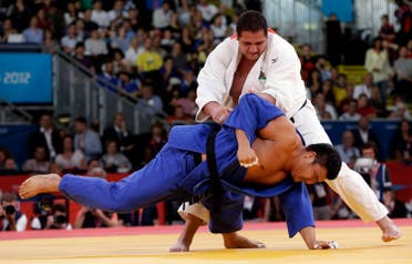 Brazil's Rafael Silva (white) fights with South Korea's Kim Sung-min during their men's +100kg bronze medal judo match at the London 2012 Olympic Games August 3, 2012. REUTERS